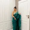 Green organza ruffles saree with hand embroidered blouse