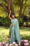 Aqua blue chinnon saree with hand embroidered blouse 1