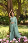 Aqua blue chinnon saree with hand embroidered blouse 4