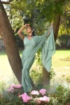 Aqua blue chinnon saree with hand embroidered blouse 3