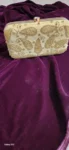 white purse with golden embroidered