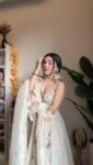 Off White Floral Hand Embroidered Tissue Lehenga 5